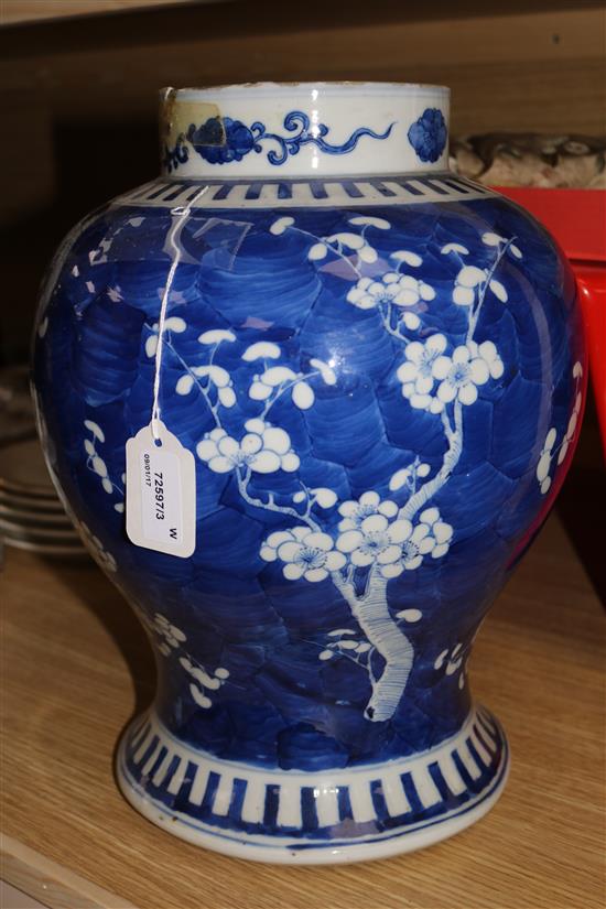 A Chinese blue and white prunus pattern vase and cover, Kangxi mark, 47cms (a.f.)